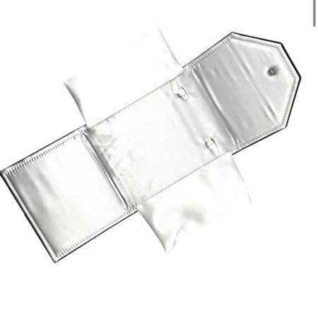 open black leatherette necklace folder showing soft white satin interior with snaps for necklaces