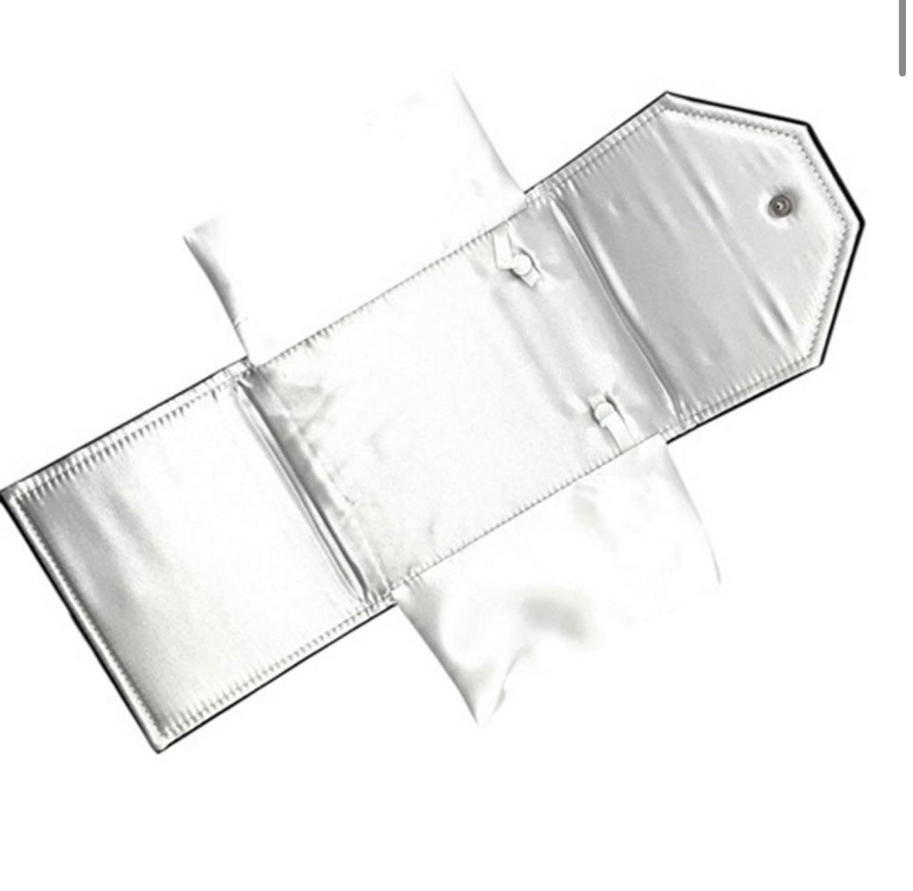 open black leatherette necklace folder showing soft white satin interior with snaps for necklaces
